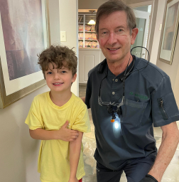 Doctor Moulton with young boy dental patient