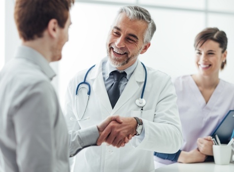 Man shaking hands with his dentist