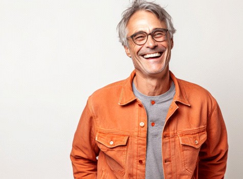 Man smiling with dental crowns in Hoover