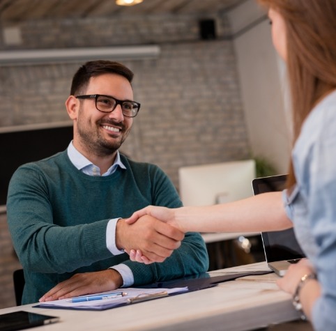 Dental patient shaking hands with Delta Dental dentist in Hoover