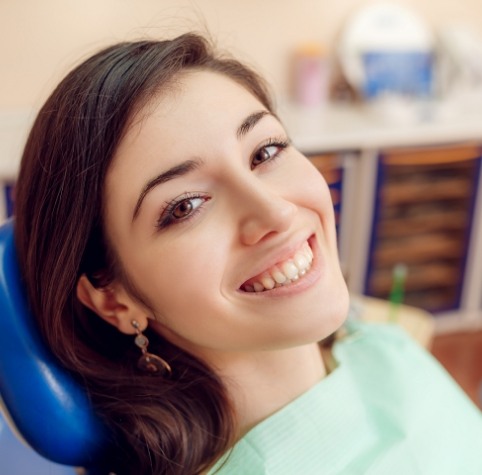 Young woman smiling during dental checkup in Hoover