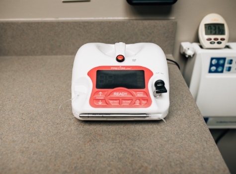 Charging station for dental soft tissue laser