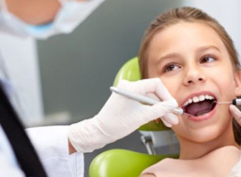 Child receiving a dental exam