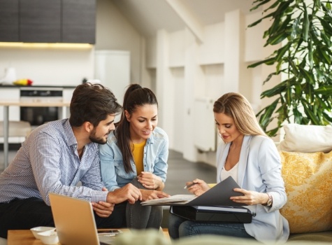 Dental patients looking at dental insurance paperwork