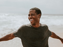 Man on beach smiling