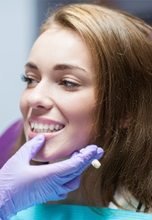 patient smiling while visiting dentist 