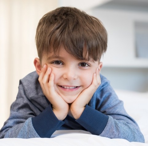 Young boy smiling with tooth colored fillings for kids in Hoover