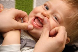 Young boy with baby teeth growing in
