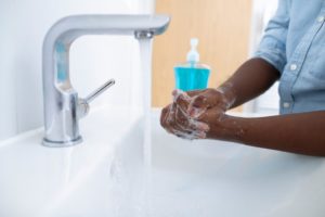 person washing their hands during the COVID-19 crisist