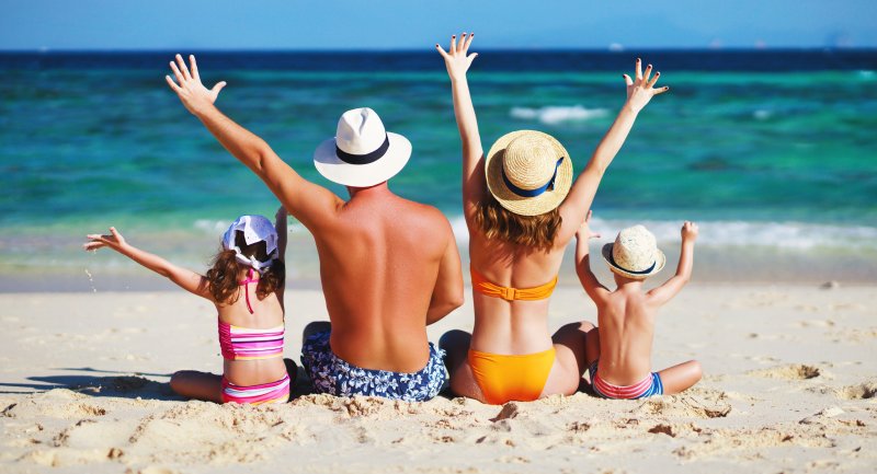 family at the beach during summer vacation