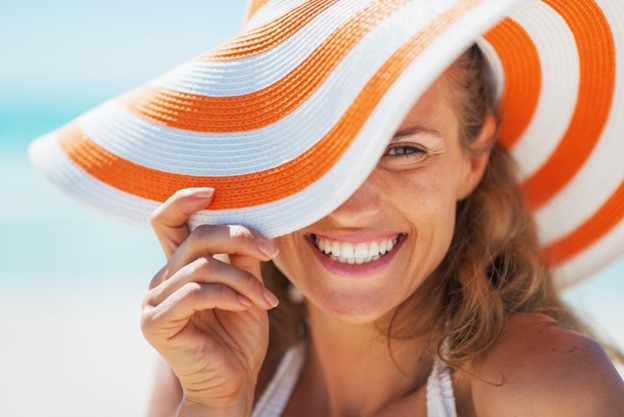 Woman smiling in the summer sun.
