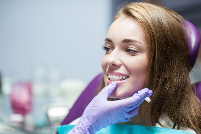 patient smiling while visiting dentist in Hoover