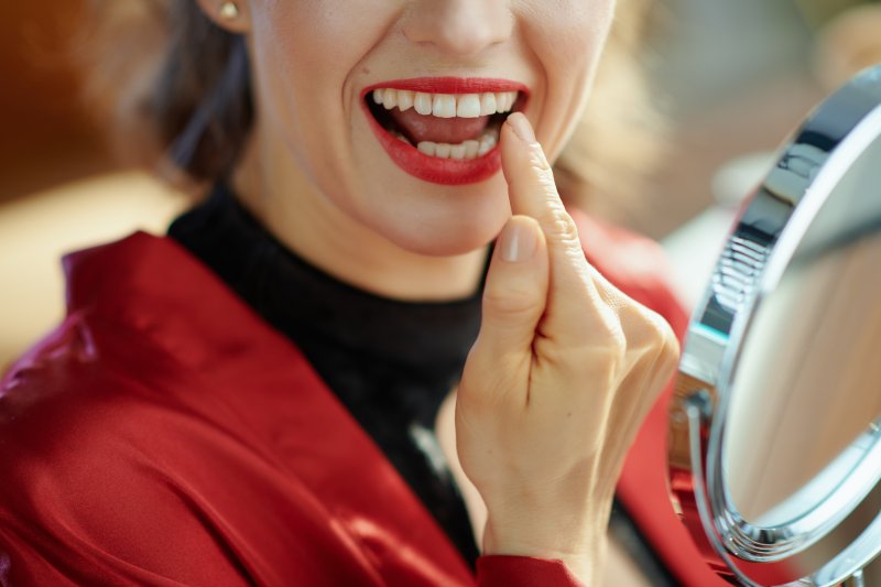 Patient smiling after whitening their tooth discoloration